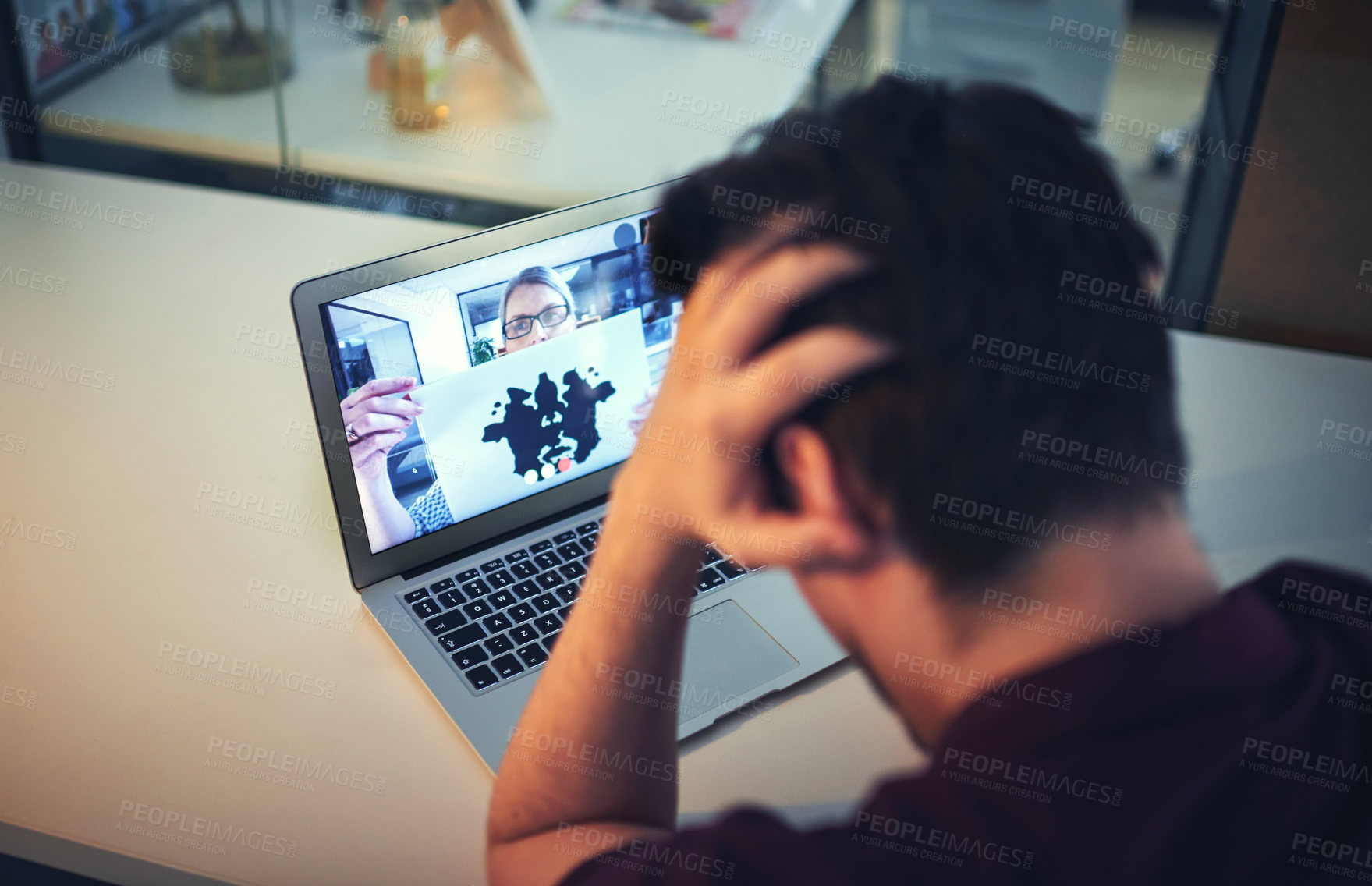 Buy stock photo Shot of a psychologist conducting an inkblot test with her patient during an online therapeutic session