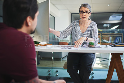 Buy stock photo Shot of a young man having a therapeutic session with a psychologist