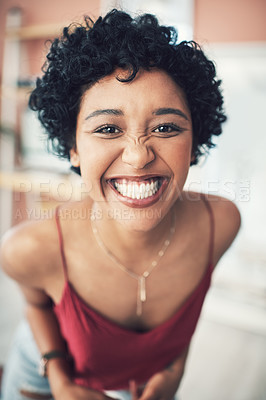 Buy stock photo Cropped shot of a beautiful young woman smiling at the camera
