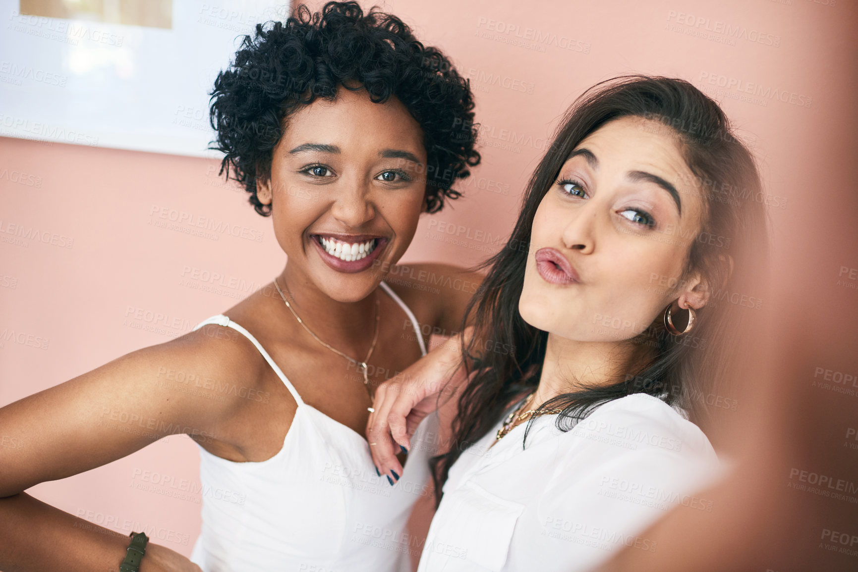 Buy stock photo Cropped shot of two young women taking a selfie together