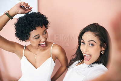 Buy stock photo Cropped shot of two young women taking a selfie together
