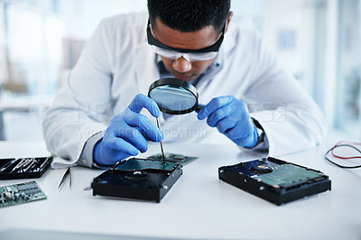 Buy stock photo Engineering, hardware and man in lab with magnifying glass in motherboard maintenance, repair or technology. IT, research and electronic technician with circuit board, tools and computer innovation.