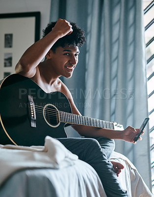 Buy stock photo Music, phone and guitar with portrait of man in bedroom for acoustic, online tutorial and jazz performance. Artist, creative and theater with person playing instrument at home for streaming talent