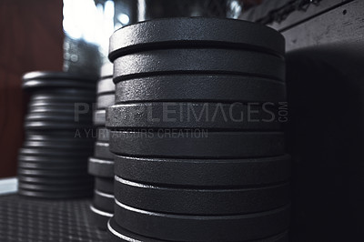 Buy stock photo Still life shot of weight plates in a gym