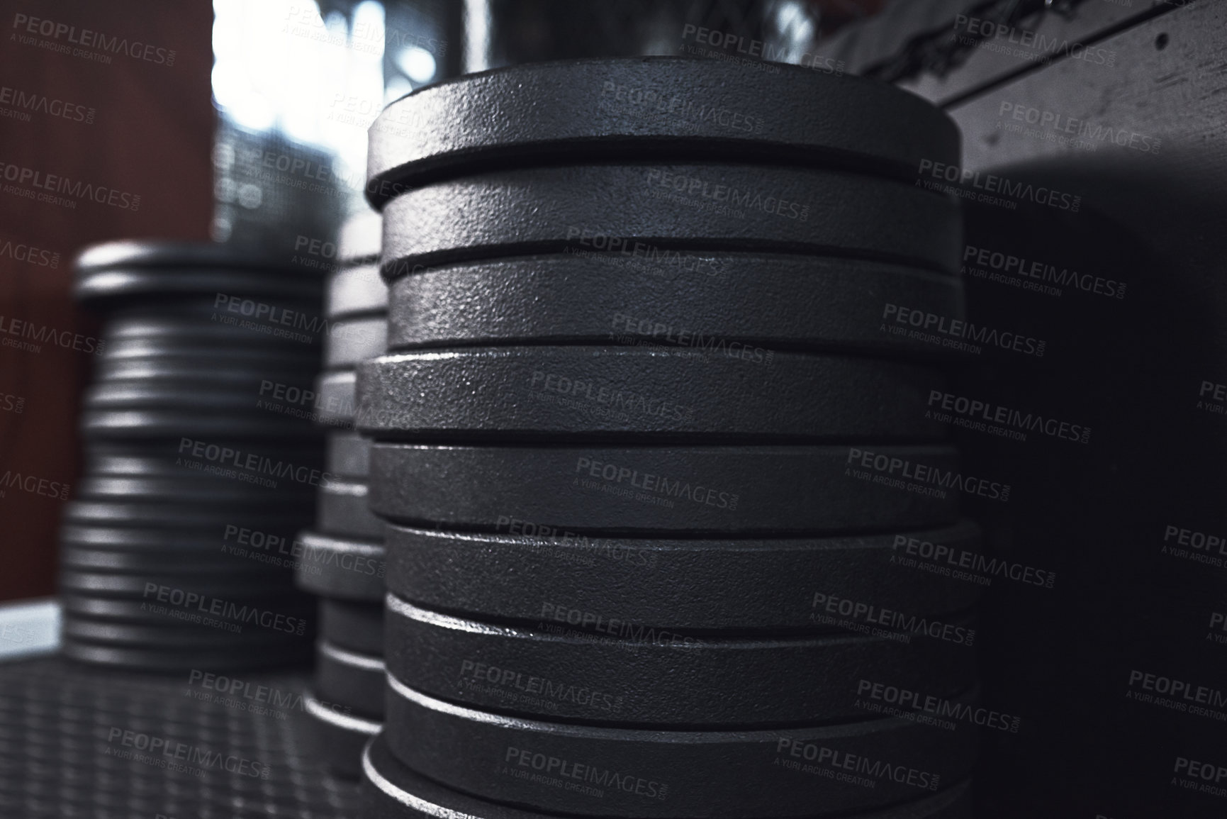 Buy stock photo Still life shot of weight plates in a gym