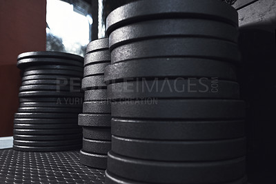 Buy stock photo Still life shot of weight plates in a gym