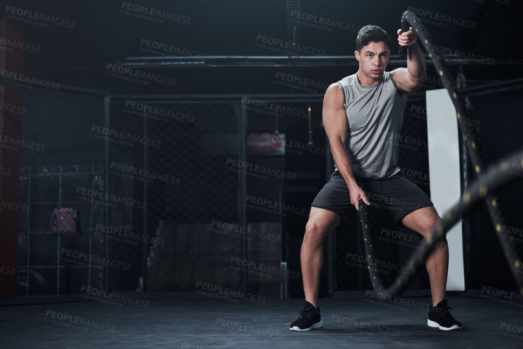 Buy stock photo Fitness, battle ropes and man at the gym doing strength, cardio and challenge workout. Strong, energy and male athlete doing exercise or training with equipment for health and wellness in sports club