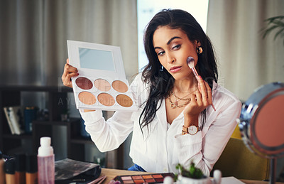 Buy stock photo Shot of a influencer recording a makeup tutorial for her blog at home