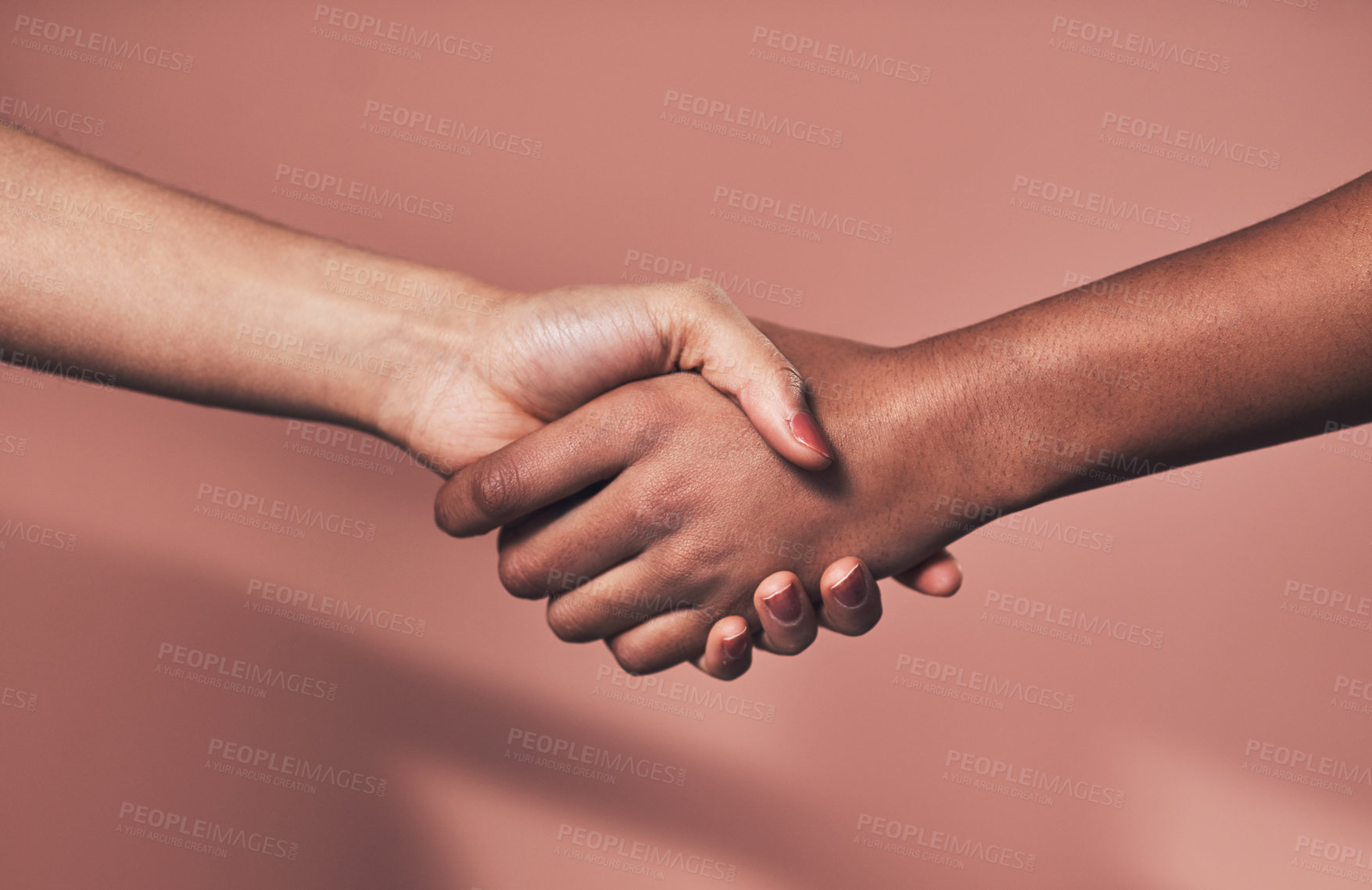 Buy stock photo Handshake, people and friends with deal in studio for partnership, thank you and welcome of recruitment. Woman, introduction and agreement of negotiation for onboarding opportunity on pink background