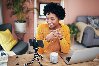 Buy stock photo Cropped shot of a woman recording a video for her blog at home