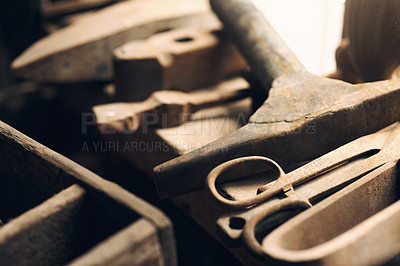 Buy stock photo Shot of various blacksmith tools at a foundry