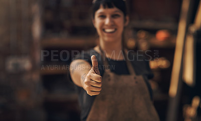 Buy stock photo Thumbs up, factory and woman blacksmith in workshop for industry, manufacturing and manual labor. Industrial warehouse, welding and female person with hand sign for steel, iron and metal production