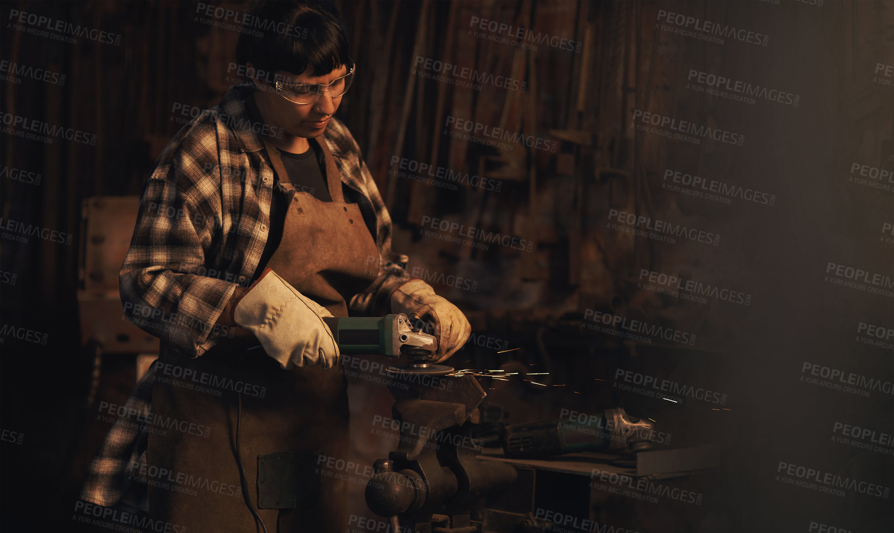 Buy stock photo Welder, factory and metal worker woman with grinder and industrial machine in warehouse of blacksmith. Steel, labor and professional with welding skills and gear with manufacturing and maintenance