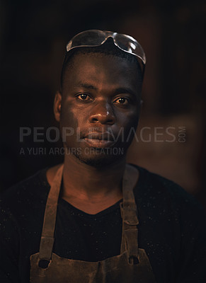 Buy stock photo Blacksmith, foundry and portrait of man in metal workshop for industry, production or trade. Face, goggles and manufacturing with African employee in forge for industrial craft, labor or welding