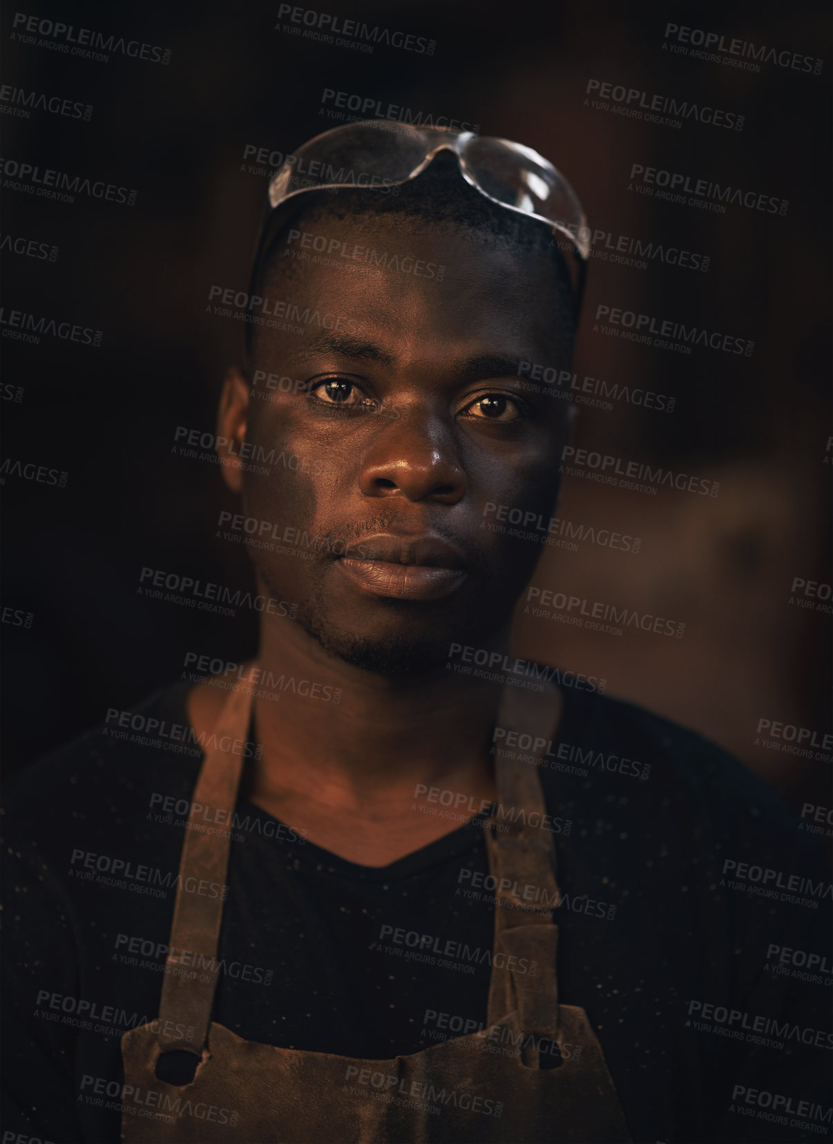 Buy stock photo Portrait of a confident young man working at a foundry
