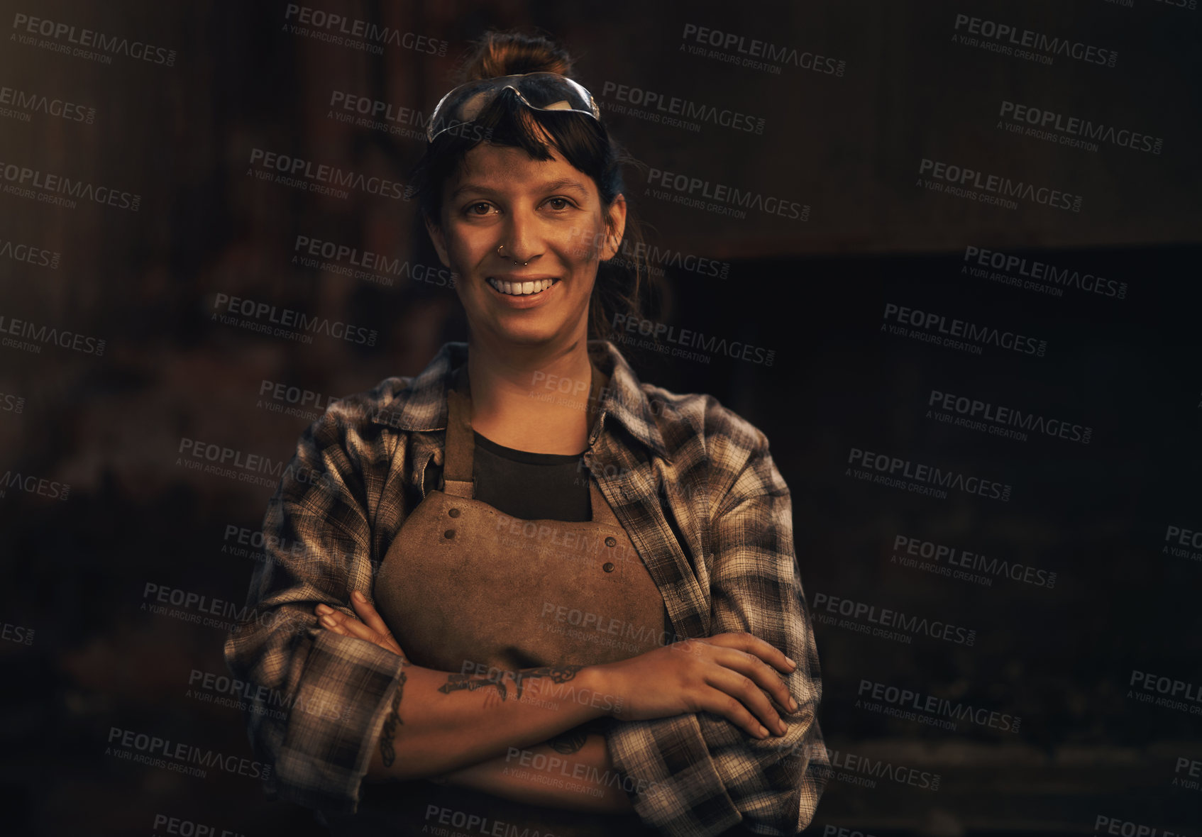 Buy stock photo Woman blacksmith, portrait and smile in workshop, industrial warehouse or trade with entrepreneurship. Small business owner, female entrepreneur or confident in factory, industry or metalwork artisan