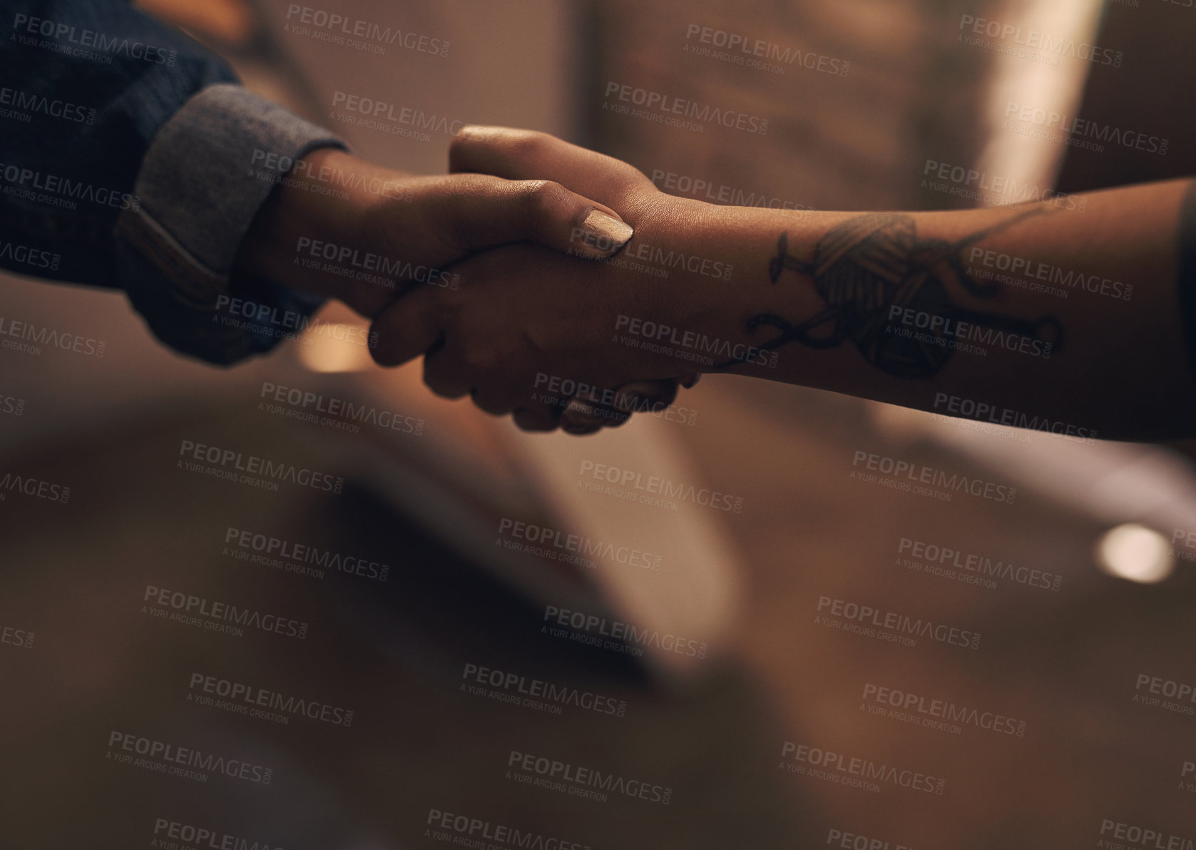 Buy stock photo Cropped shot of an unrecognisable man and woman shaking hands at a foundry