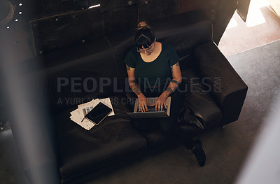 Buy stock photo Woman, laptop and working on sofa in workplace for administration, research and check inventory report. Female employee, top view and typing on couch in lobby for company website update or database