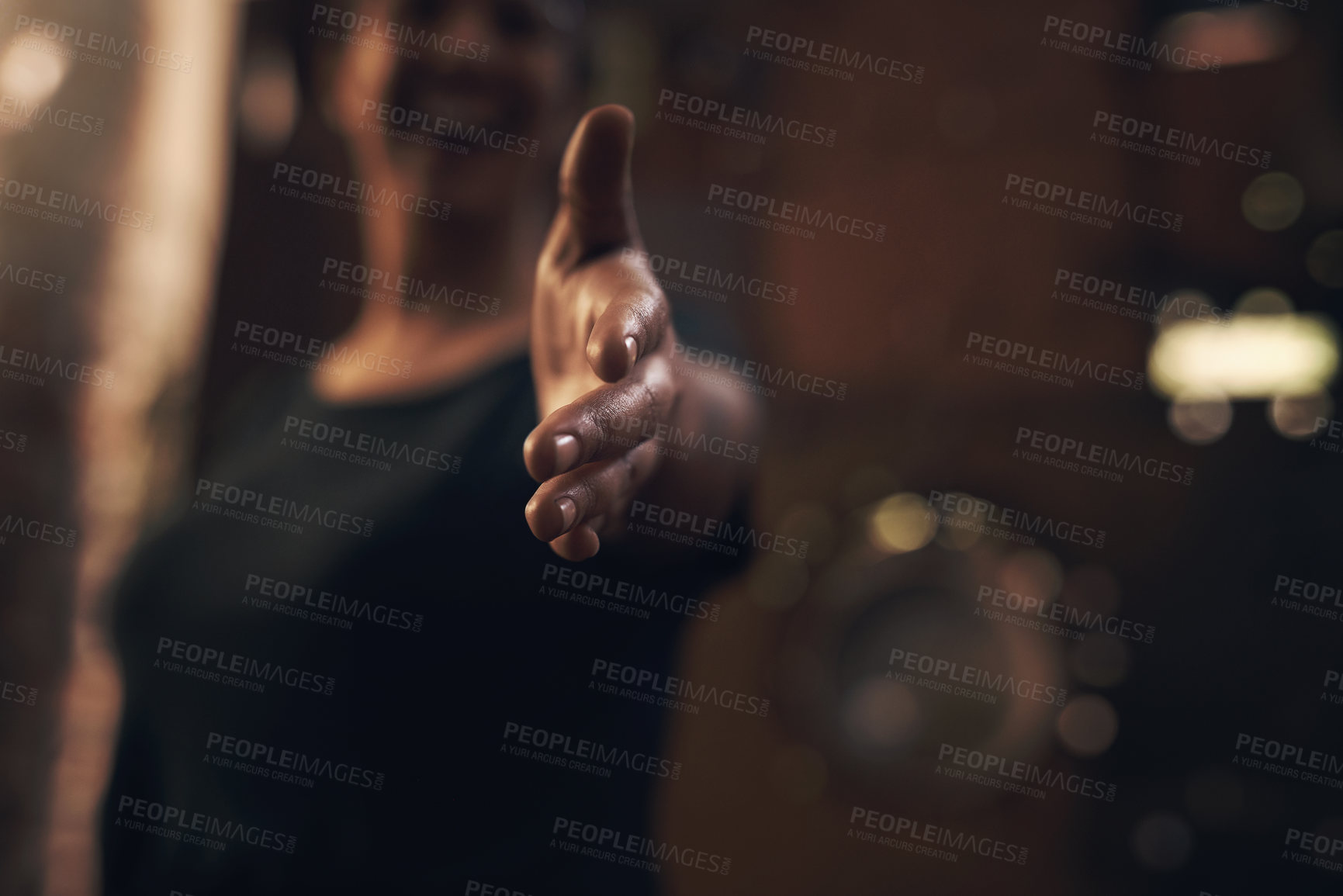 Buy stock photo Cropped shot of an unrecognisable woman extending her arm for a handshake at a foundry