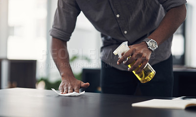 Buy stock photo Closeup shot of an unrecognisable businessman cleaning a workspace in an office