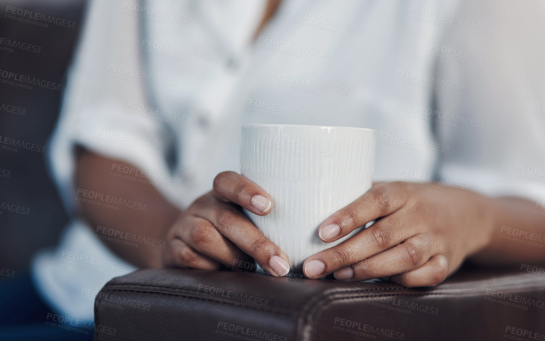 Buy stock photo Closeup shot of an unrecognisable businesswoman drinking coffee while taking a break in an office