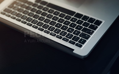 Buy stock photo Still life shot of a laptop on a table in an office