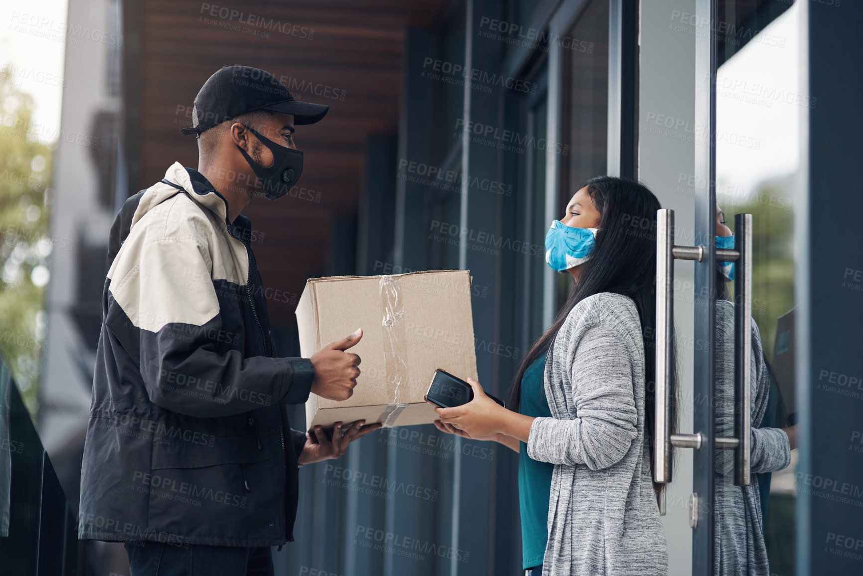 Buy stock photo Delivery guy, woman and face mask with box for courier service, online shopping and distribution compliance. Man, customer and giving package, commerce safety and    ecommerce shipping at front door