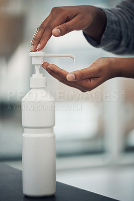 Buy stock photo Shot of an unrecognisable man disinfecting his hands with hand sanitiser