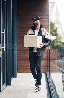 Buy stock photo Walking, door and delivery man with box at building for online shopping order, courier service and shipping. Ecommerce, supply chain and person with face mask for package, parcel or mail distribution