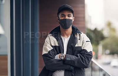 Buy stock photo Shot of a masked young man making a home delivery