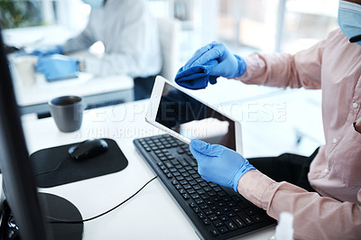 Buy stock photo Closeup shot of an unrecognisable businessman cleaning a digital tablet in an office