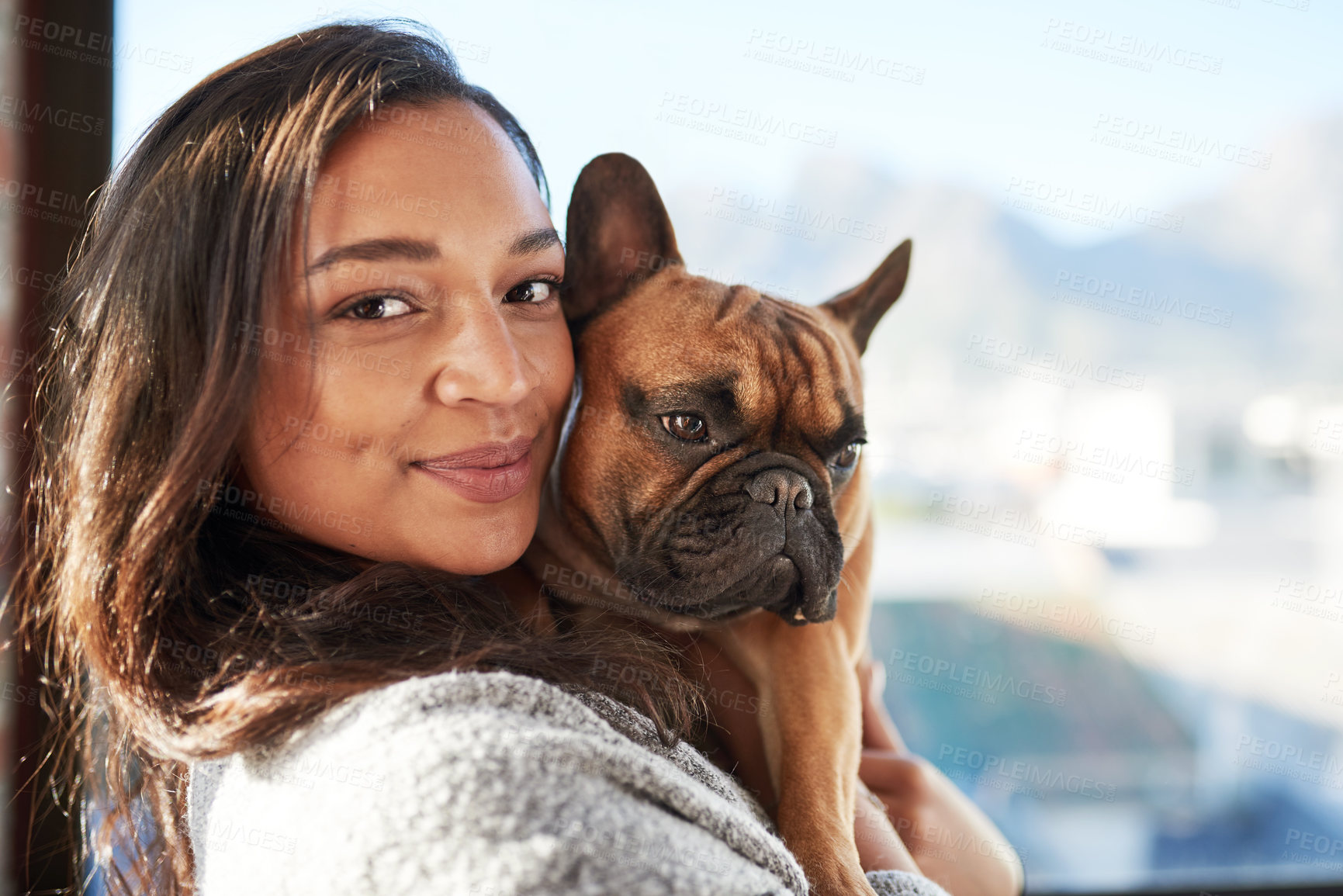 Buy stock photo Portrait of a young woman relaxing with her dog at home