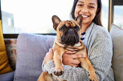 Buy stock photo Portrait of a young woman relaxing with her dog at home