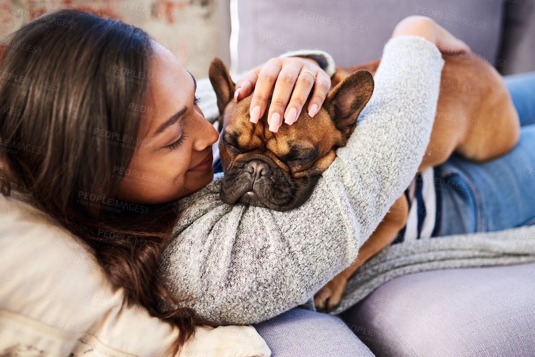 Buy stock photo Woman, dog and relax on sofa with hug, comfort and support animal for mental health. Happy girl, pet adoption and love in home living room with trust, bonding and sleeping Bulldog with owner on couch