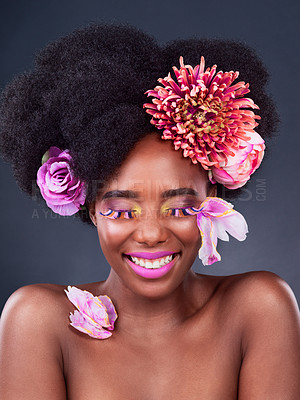 Buy stock photo Flowers, makeup and portrait of happy black woman for beauty, creative and spring. Natural, cosmetics and floral with face of female model in studio for aesthetic, self love and organic skincare.