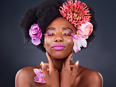 Buy stock photo Makeup, flowers and beauty with black woman in studio for color, creative and spring. Natural, cosmetics and floral with african model isolated on background for art, self love or confidence