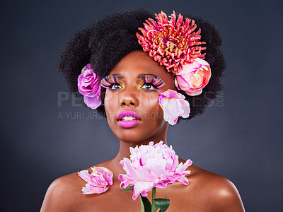 Buy stock photo Flowers, makeup or black woman with beauty, shine dermatology on dark studio background. African person, skincare or girl with natural treatment, sustainable cosmetics or floral texture with wellness
