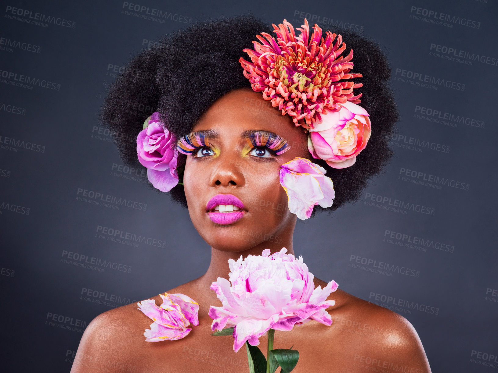 Buy stock photo Flowers, makeup or black woman with beauty, shine dermatology on dark studio background. African person, skincare or girl with natural treatment, sustainable cosmetics or floral texture with wellness