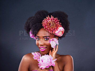 Buy stock photo Beauty, flowers and portrait with smile of black woman in studio on dark background for natural cosmetics. Face, makeup or skincare and happy young model with protea in hair for aesthetic wellness