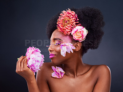 Buy stock photo Black woman, afro or flowers of natural, hair care or beauty of spring, spa or wellness in studio. African girl, rose or plant aesthetic as idea, art or happy as organic mockup on grey background