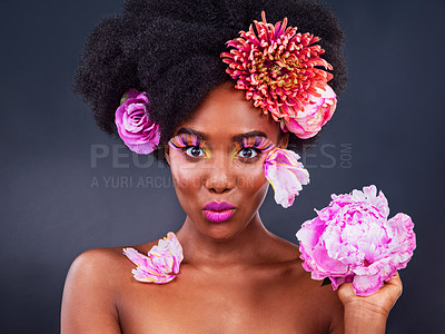 Buy stock photo Makeover, flowers and portrait of afro black woman in studio on dark background for natural cosmetics. Beauty, face or makeup and young model with protea in hair for aesthetic wellness at spa