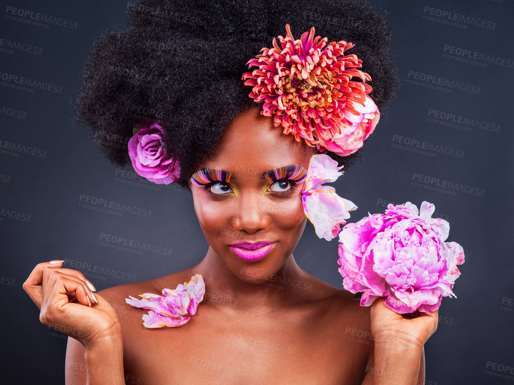 Buy stock photo African, girl and beauty with flowers, happy and confidence for makeup, skincare and wellness in studio. Female person, pose and smile for fashion, style and luxury in grey background for cosmetics