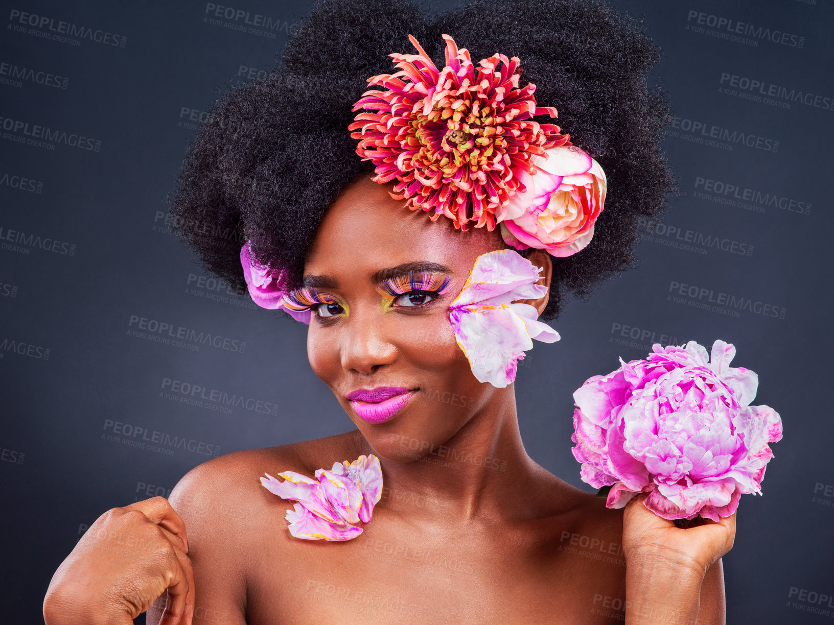 Buy stock photo Beauty, flowers and makeup portrait of black woman in studio on dark background for natural cosmetics. Afro, face or skincare and young model with protea in hair for aesthetic wellness at spa