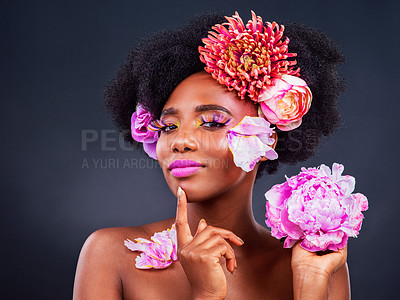 Buy stock photo Flowers, idea and portrait of afro black woman in studio on dark background for cosmetics or editorial. Beauty, face makeup or thinking and young model with protea in hair for aesthetic wellness
