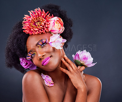 Buy stock photo Beauty, flowers and black woman in studio for makeup, creative and organic on black background. Floral, body care and african female model pose with eco friendly, natural and cosmetics with mockup 