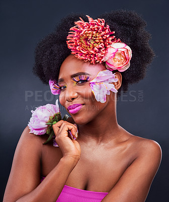 Buy stock photo Beauty, flowers and portrait with smile of black woman in studio on dark background for natural cosmetics. Afro, face or makeup and young afro model with protea in hair for aesthetic wellness at spa