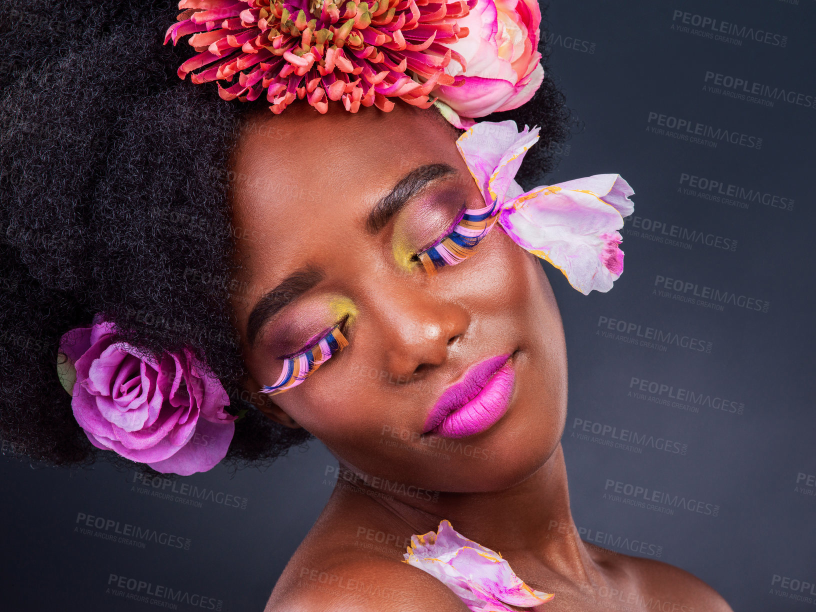 Buy stock photo African, girl and beauty with flowers, makeup and confidence for lashes, skincare and wellness in studio. Female person, art and pride for creative, style and luxury in grey background for cosmetics