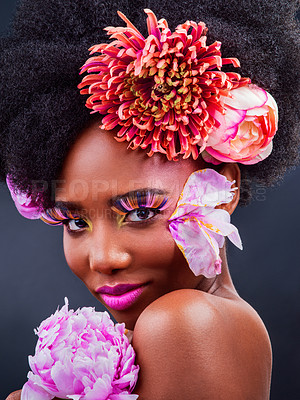 Buy stock photo Beauty, portrait and salon with afro black woman in studio on dark background for natural cosmetics. Face, makeup or spring flowers and young model with protea in hair for aesthetic wellness at spa