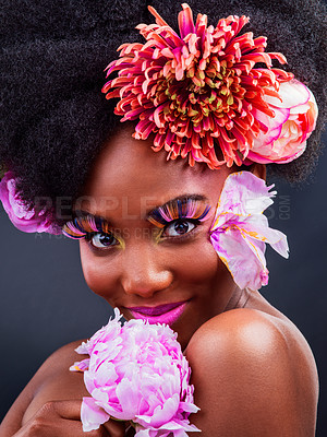 Buy stock photo Beauty, flowers and portrait of happy black woman in studio on dark background for natural cosmetics. Face, makeup or skincare and young model with protea in afro hair for aesthetic wellness at spa