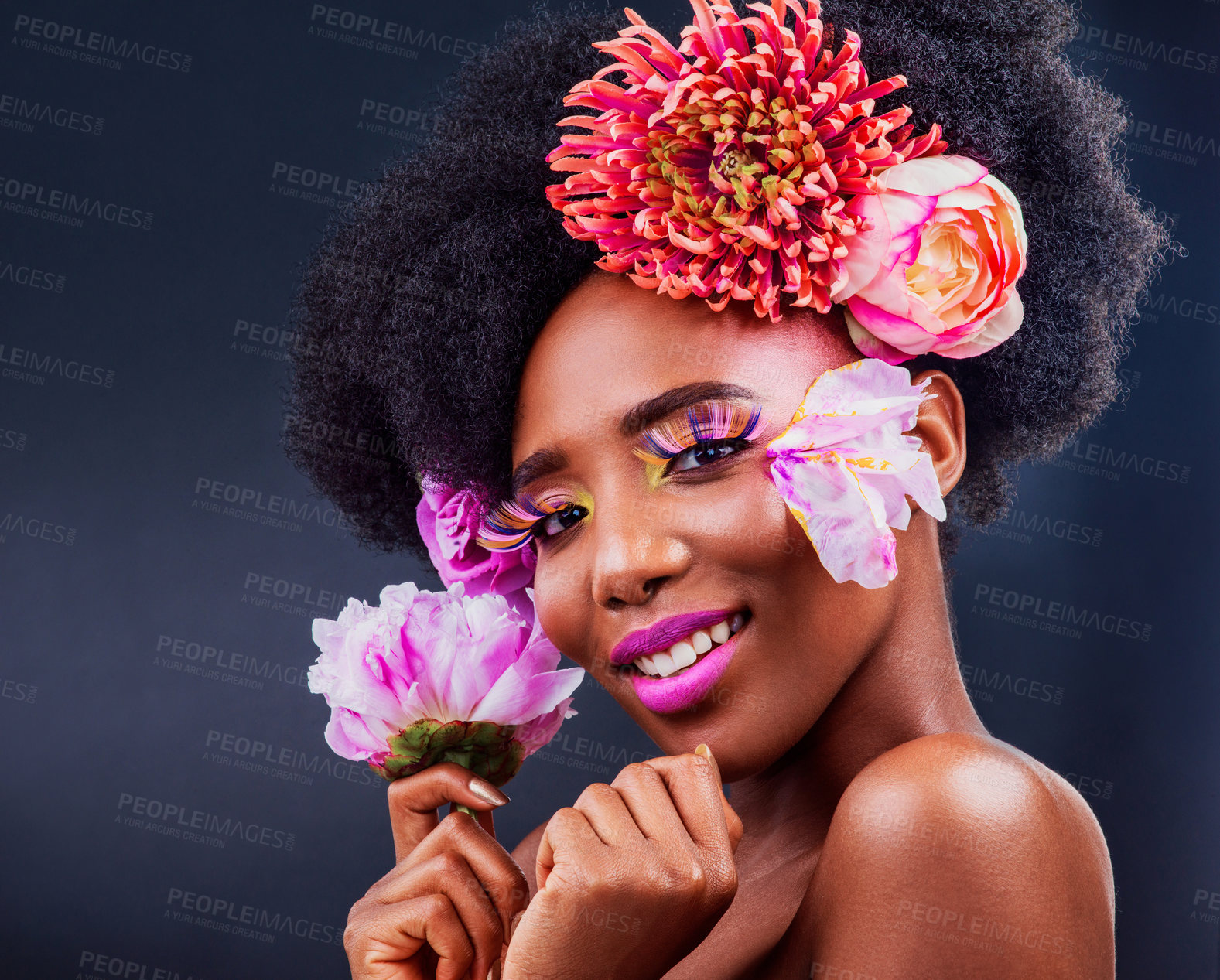 Buy stock photo Beauty, flowers and smile with portrait of black woman in studio on dark background for natural cosmetics. Face, makeup or skincare and happy model with protea in hair for aesthetic wellness at spa